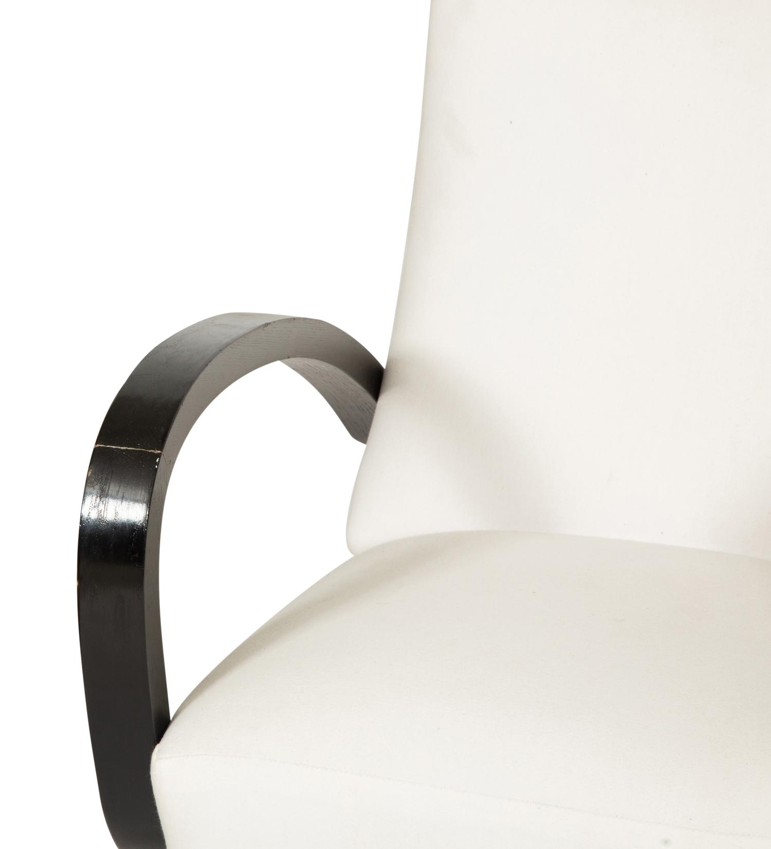 A Pair of Ebonized Oak Lounge Chairs