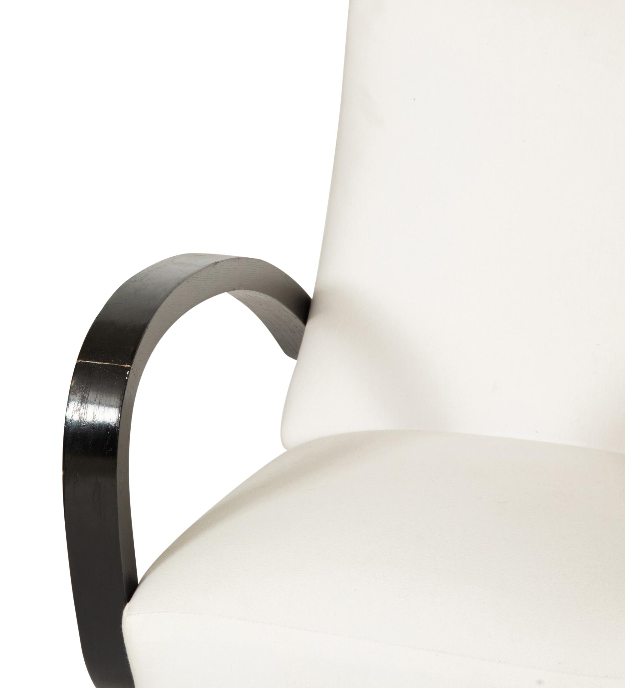 A Pair of Ebonized Oak Lounge Chairs