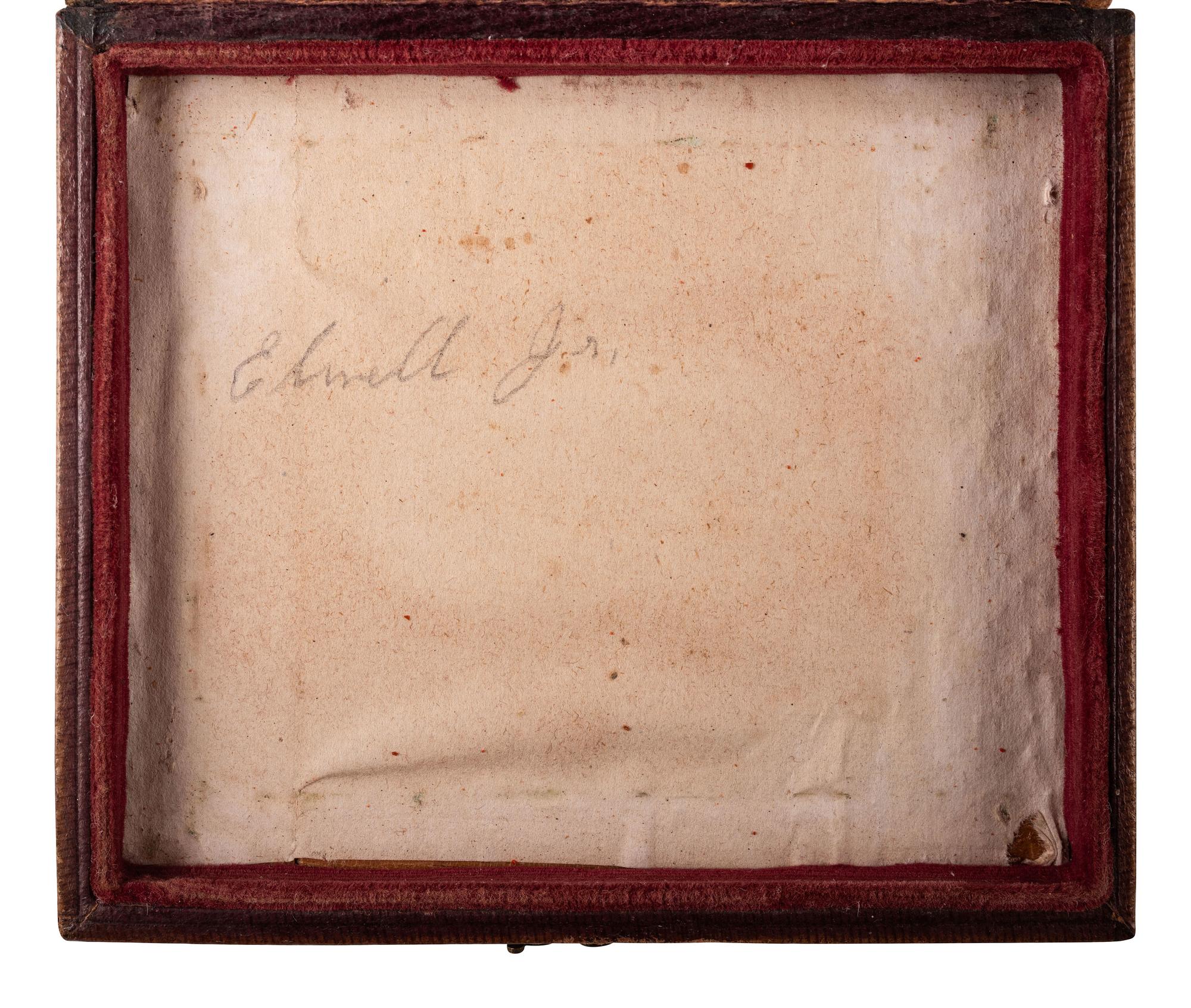 [EARLY PHOTOGRAPHY]. Sixth plate daguerreotype portrait of a pair of young brothers wearing blue jackets and embracing in a loving pose.