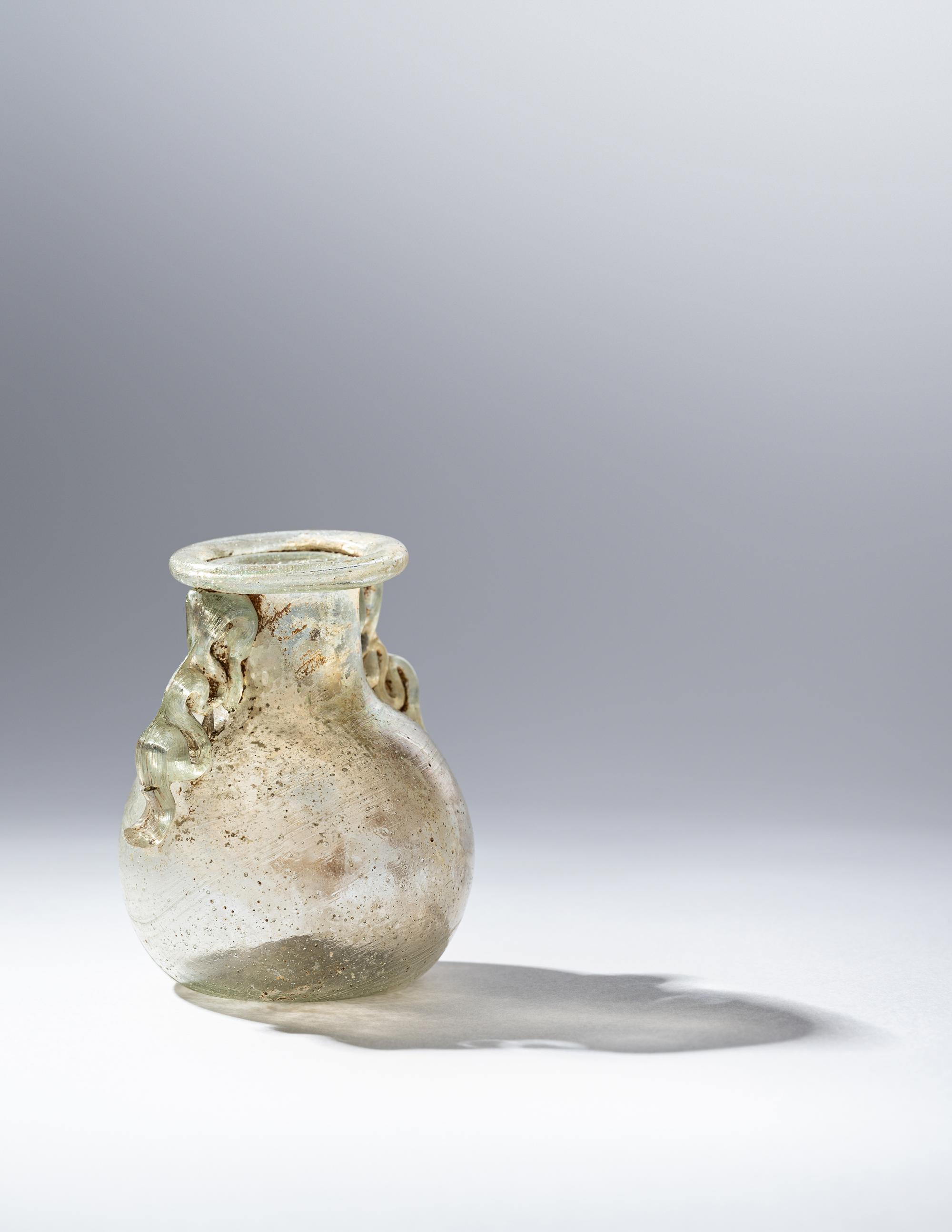 A Roman Green Glass Araballos