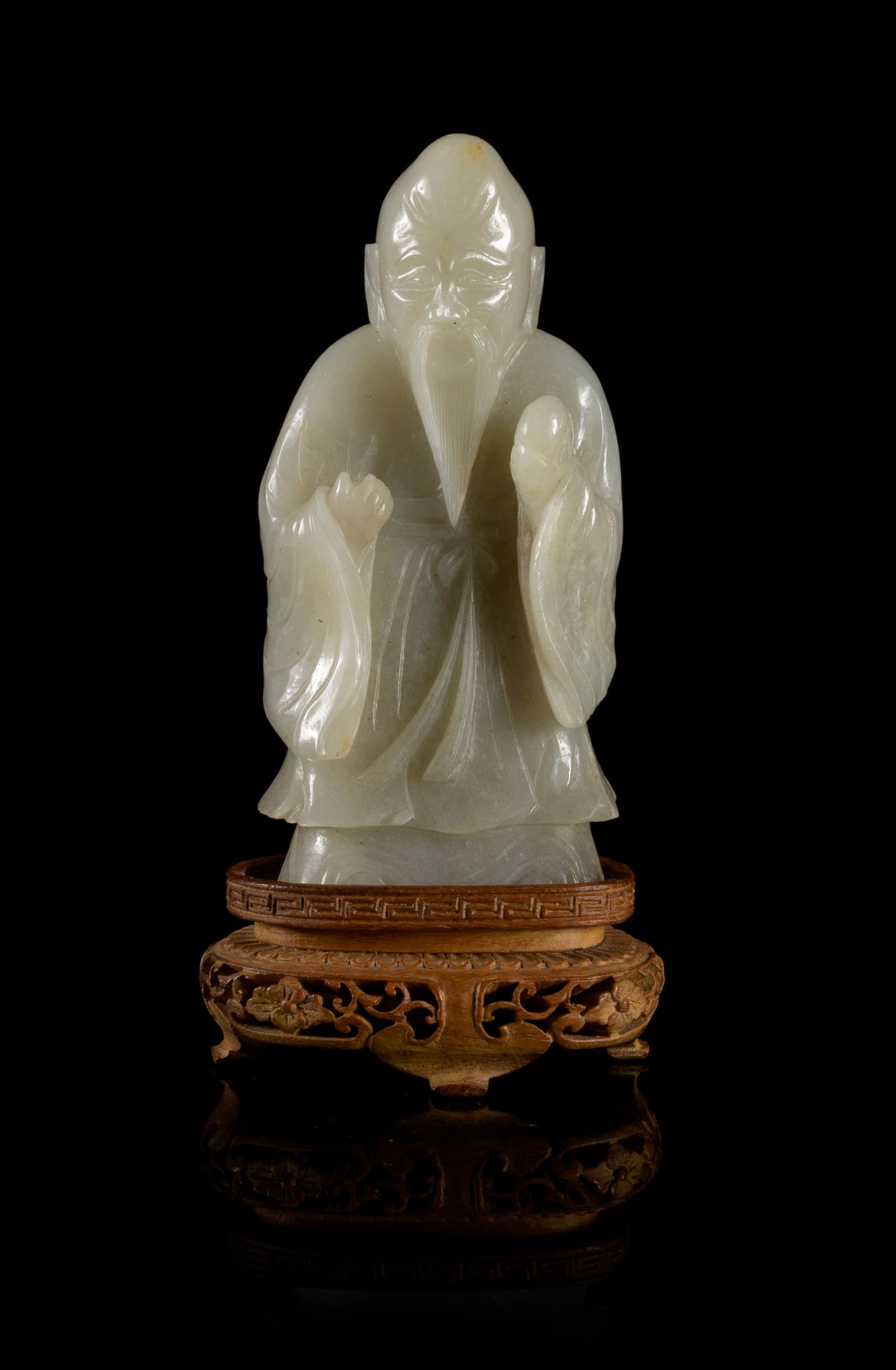 A Near-White Jade Figure of Standing Shoulao — LATE MING/EARLY QING DYNASTY