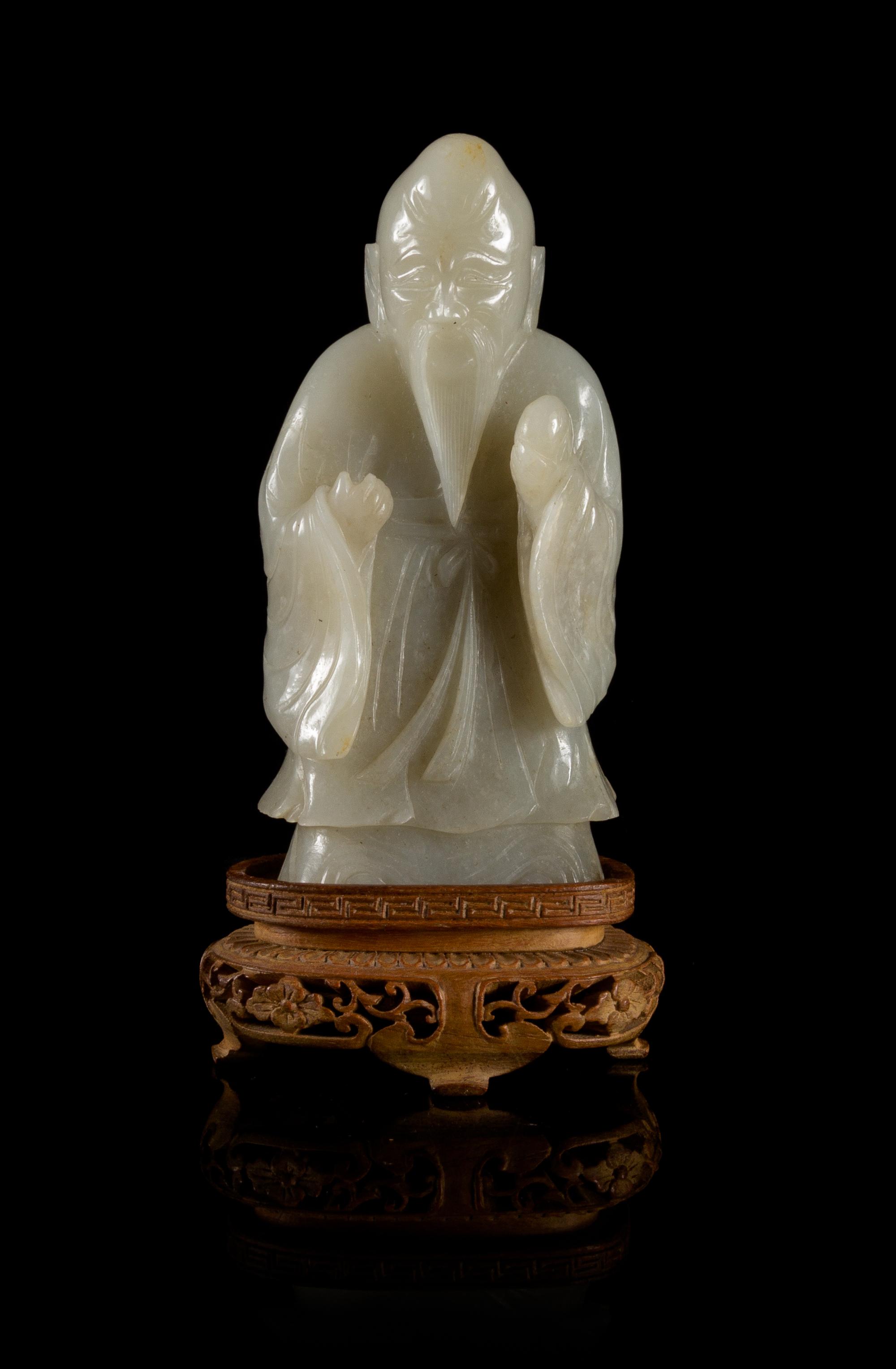 A Near-White Jade Figure of Standing Shoulao — LATE MING/EARLY QING DYNASTY
