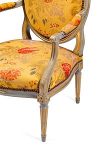 A Pair of Louis XVI Painted and Parcel Gilt Fauteuils