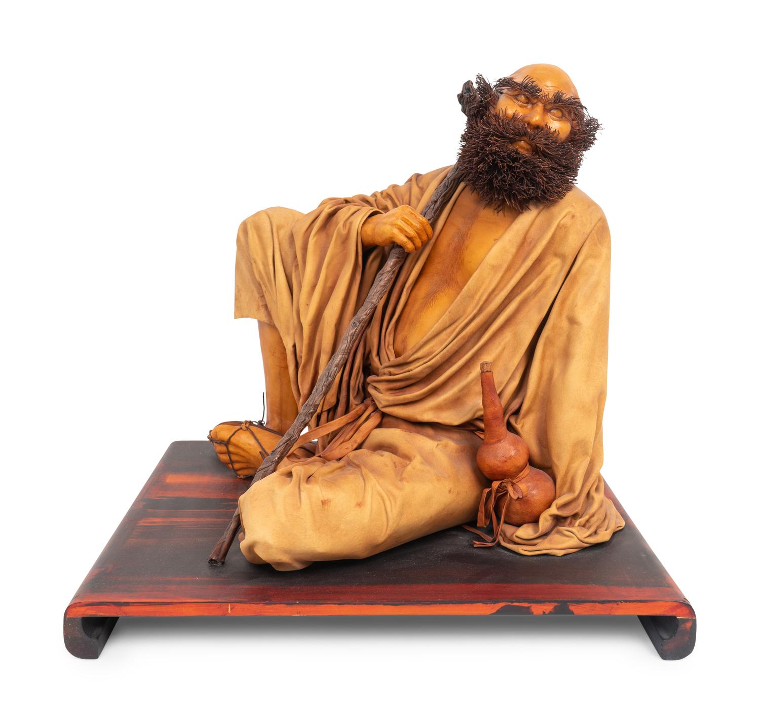 A Chinese Leather Figure — 20TH CENTURY