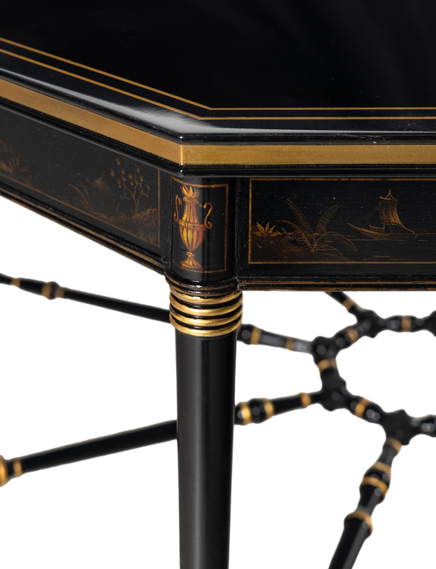 A Regency Style Ebonized and Parcel Gilt Center Table