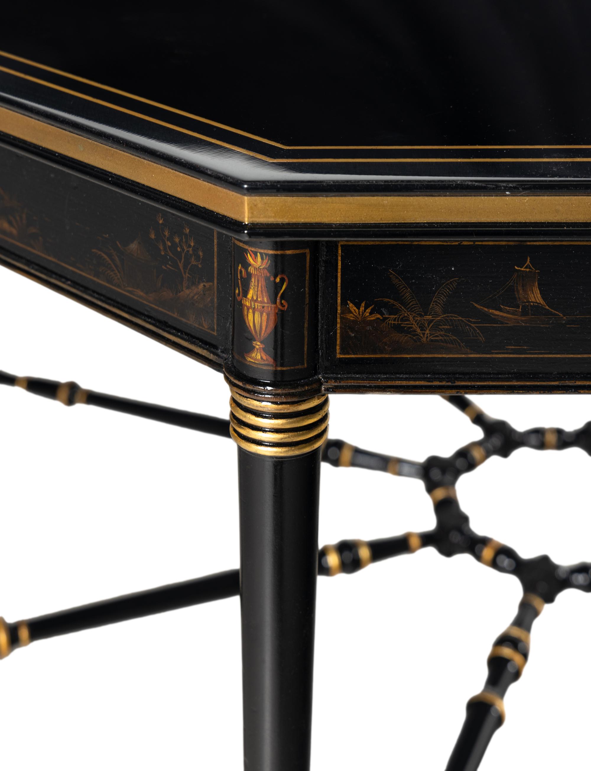 A Regency Style Ebonized and Parcel Gilt Center Table