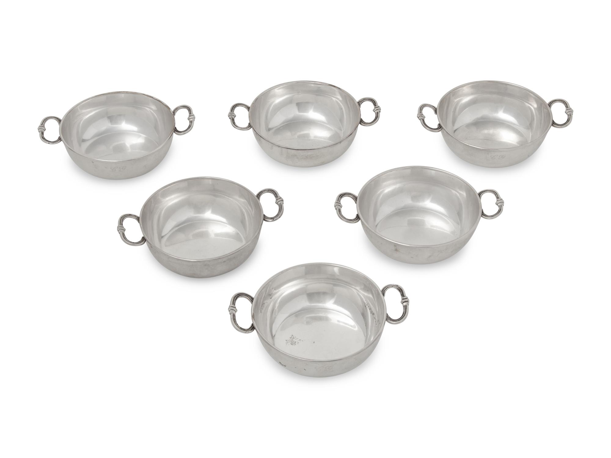 A Set of Six Silver Bowls with Handles