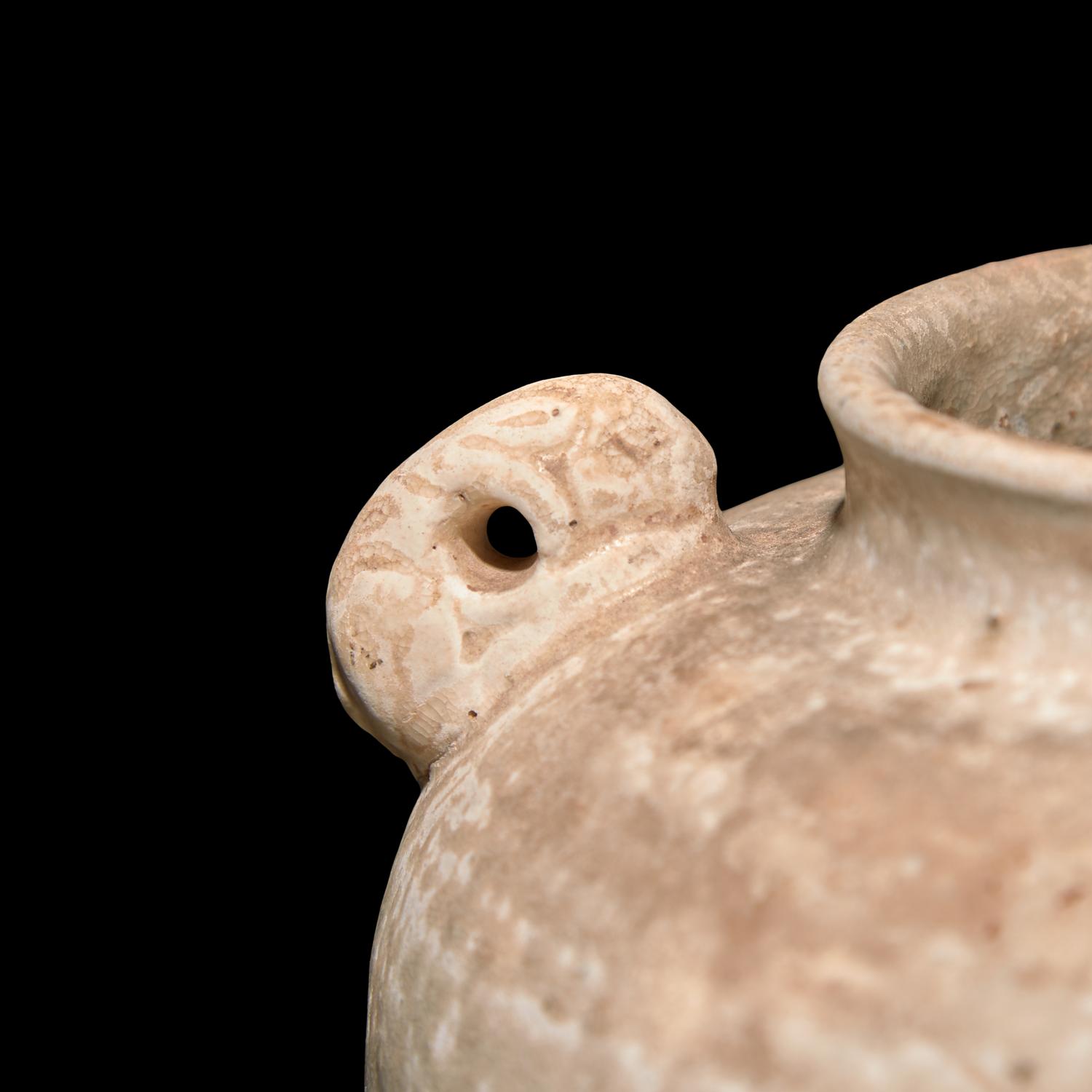 A Chinese Small Melon Form Coupe and a Small Jar, Tang Dynasty or Later 唐或以後 白釉瓜棱水呈及白陶雙系罐