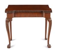 An Irish George III Carved Mahogany Flip-Top Table