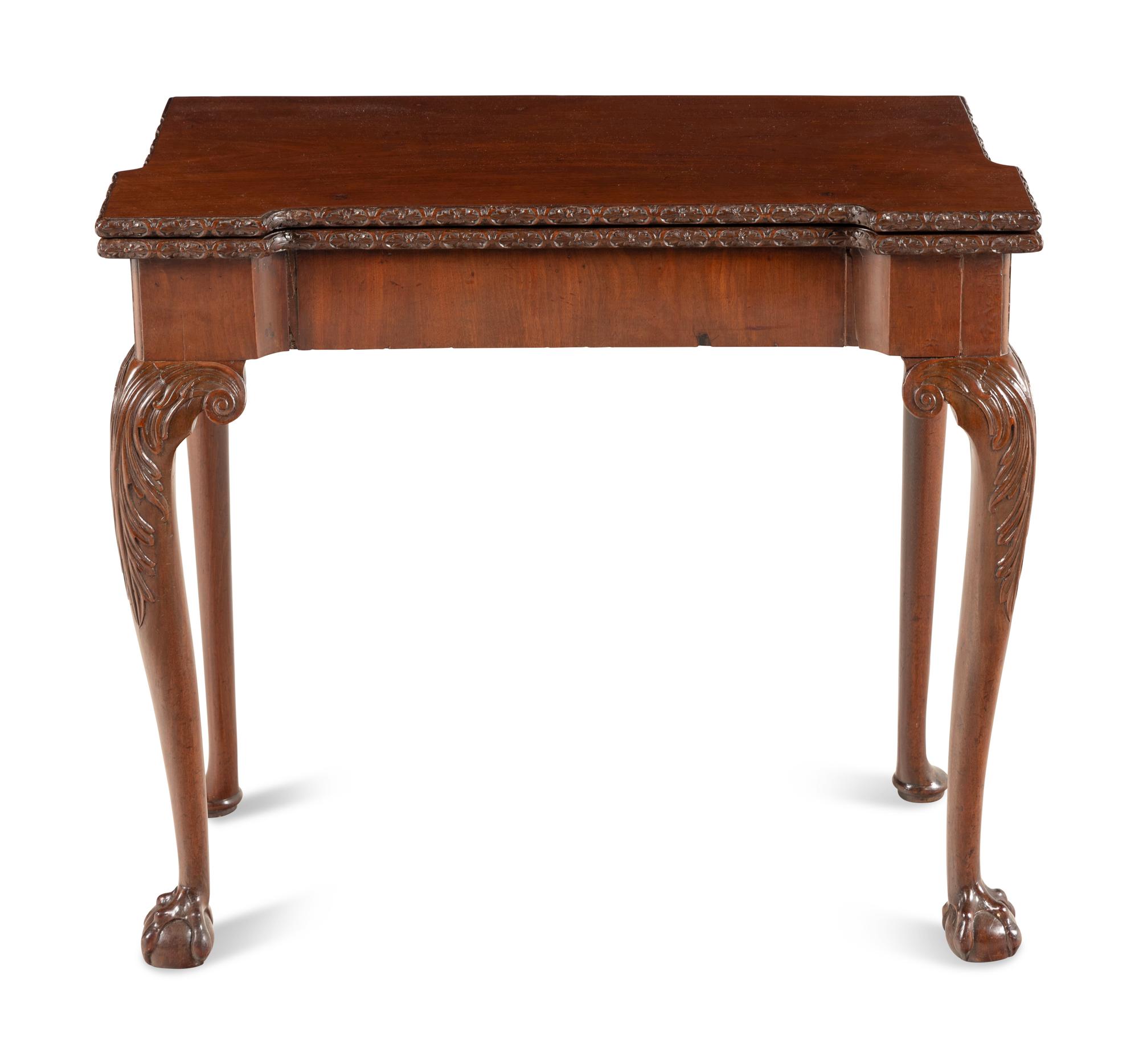 An Irish George III Carved Mahogany Flip-Top Table