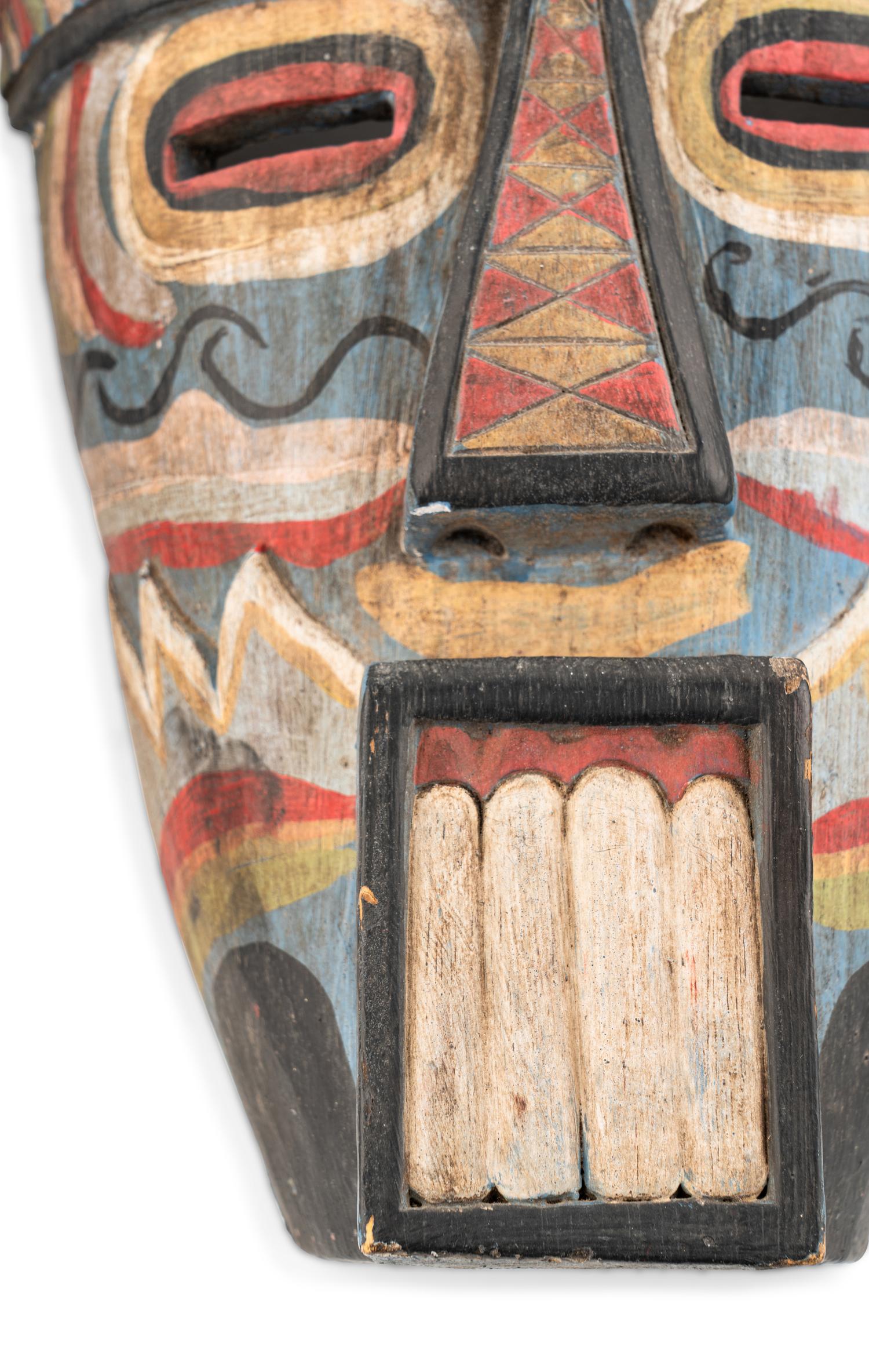 A Group of Three West African Carved Masks