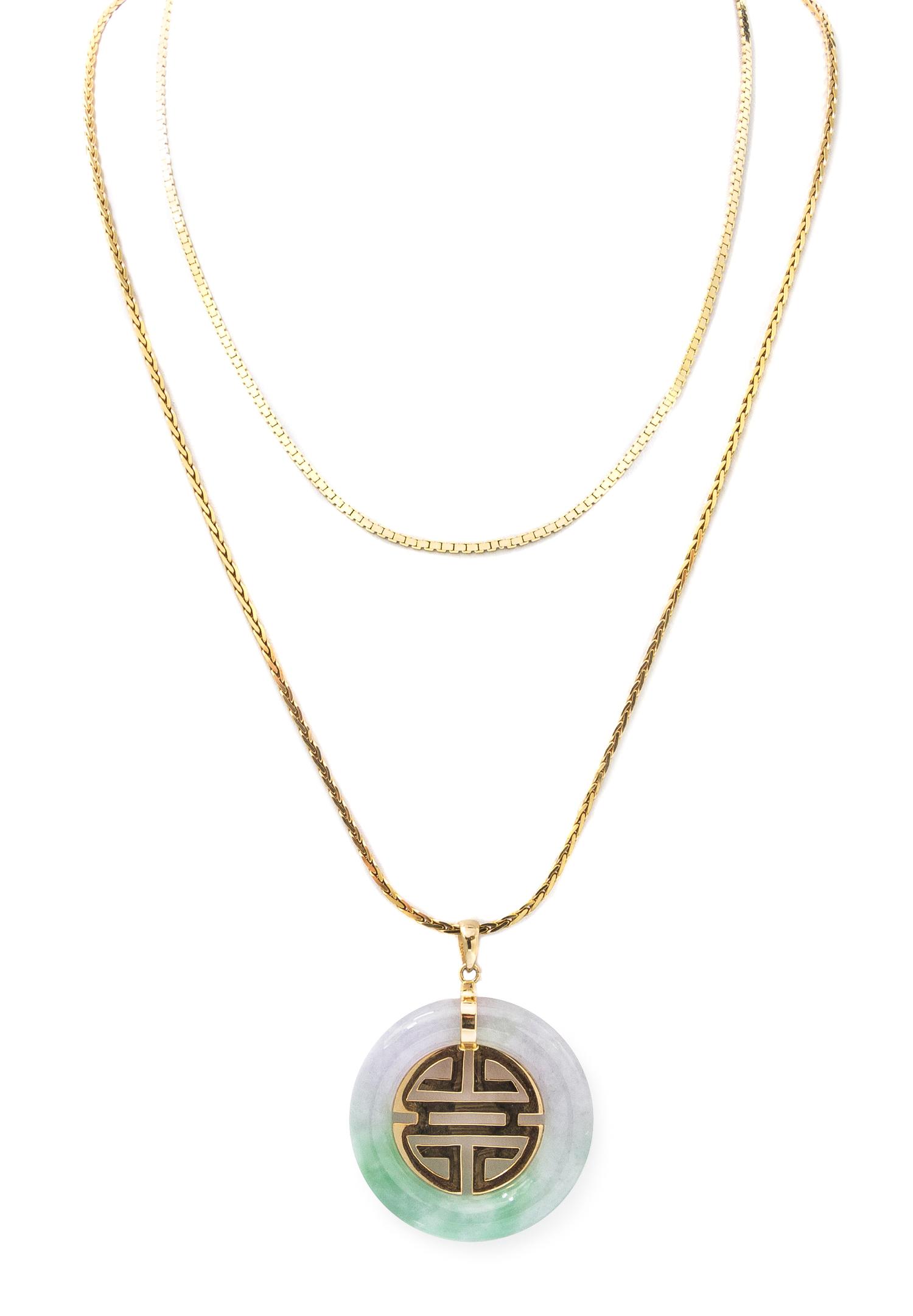 A 14 Karat Yellow Gold Jade Pendant, 17.10 dwts.