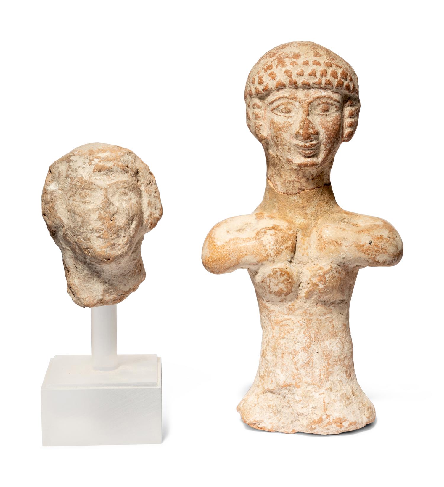 A Near Eastern Terracotta Figure and a Head