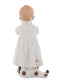A Meissen Porcelain Figure of a Boy Drinking From a Blue Onion Bowl
