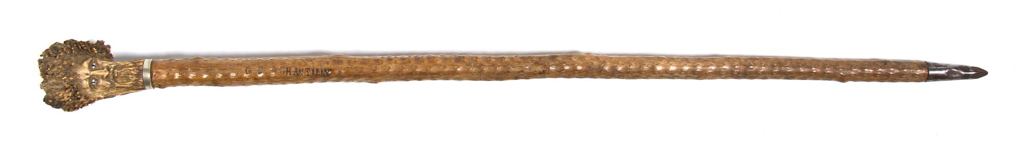An Ivory Inset Carved Antler Walking Stick, Height overall 34 3/4 inches.