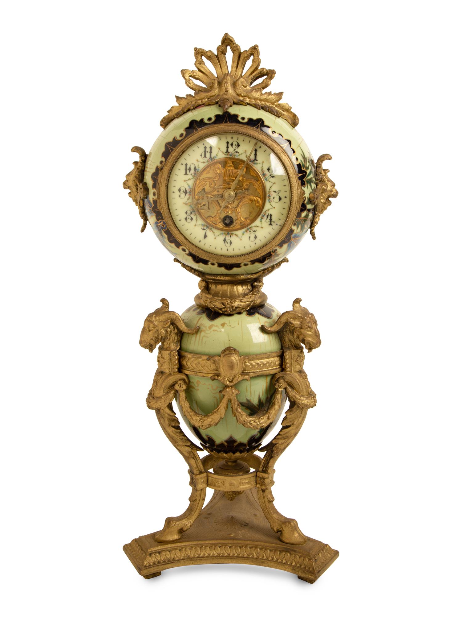 A French Gilt Bronze and Glazed Pottery Clock — LATE 19TH CENTURY