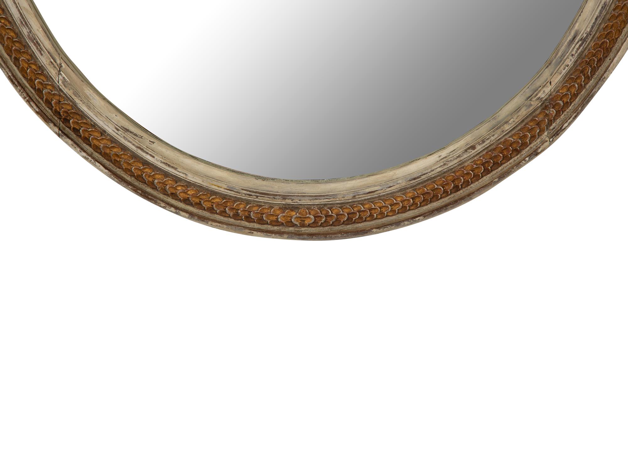 A Gustavian Style Painted and Parcel Gilt Oval Mirror