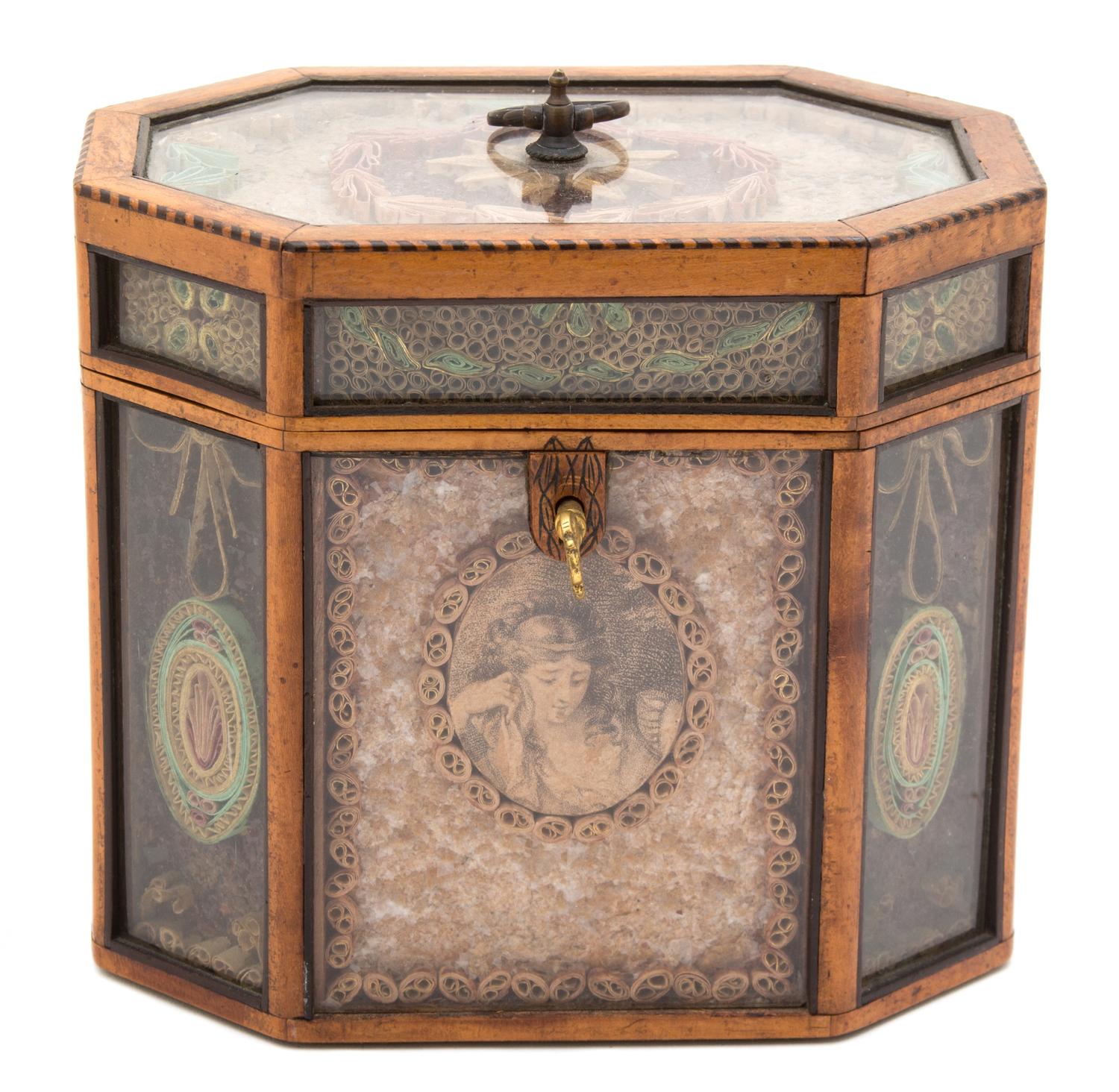 A George III Quillwork and Rolled Paperwork Octagonal Tea Caddy Height 8 inches. — 18TH CENTURY