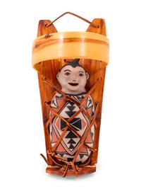 Pottery Doll in Cradle