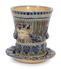 An English Majolica Jardiniere with Stand and a Cistern-form Wall Pocket