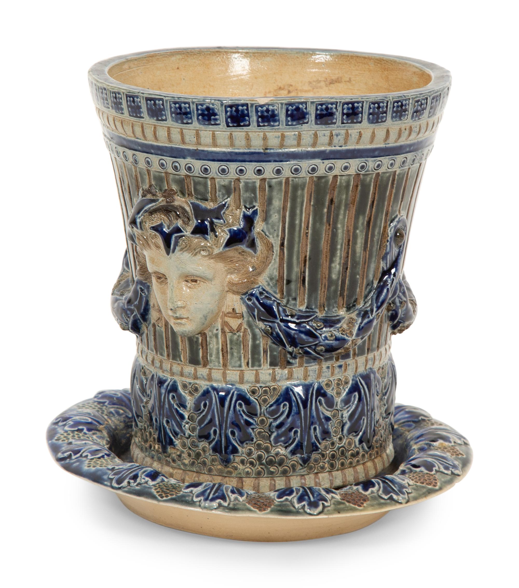 An English Majolica Jardiniere with Stand and a Cistern-form Wall Pocket