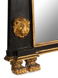An Egyptian Revival Parcel Gilt and Ebonized Lion and Paw Decorated Over Mantel Mirror