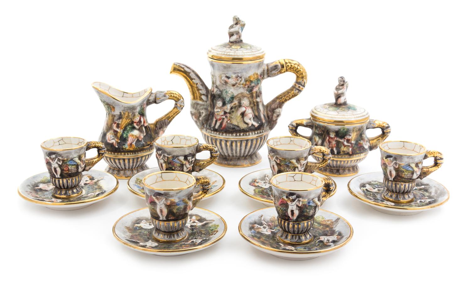 A Capo di Monte Porcelain Coffee Service Height of coffee pot 8 3/4 inches.