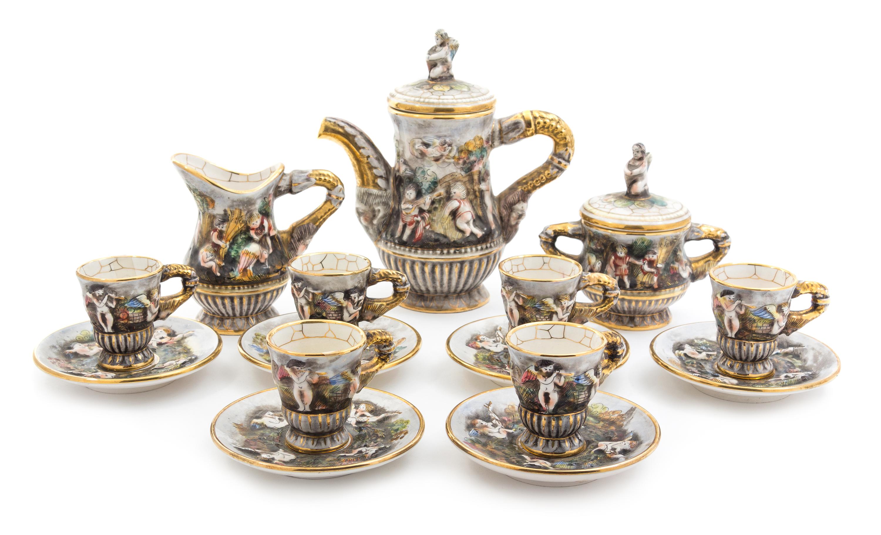 A Capo di Monte Porcelain Coffee Service Height of coffee pot 8 3/4 inches.
