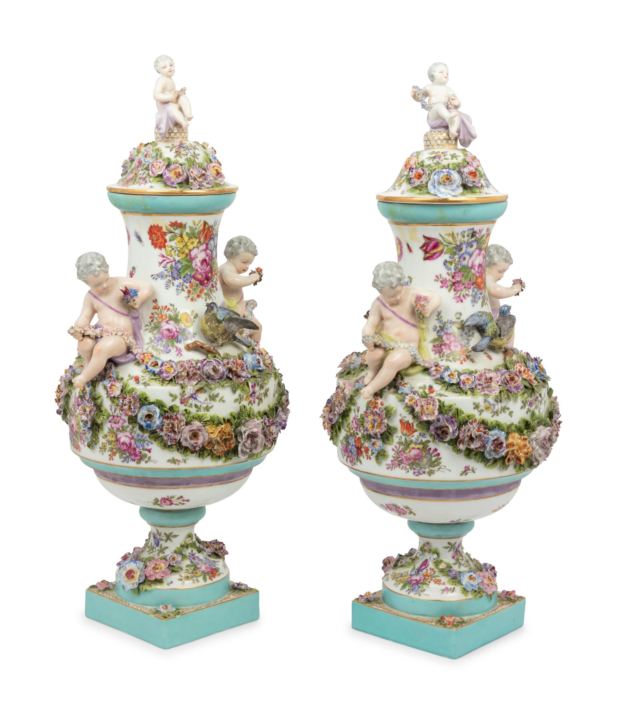 A Pair of Continental Porcelain Urns