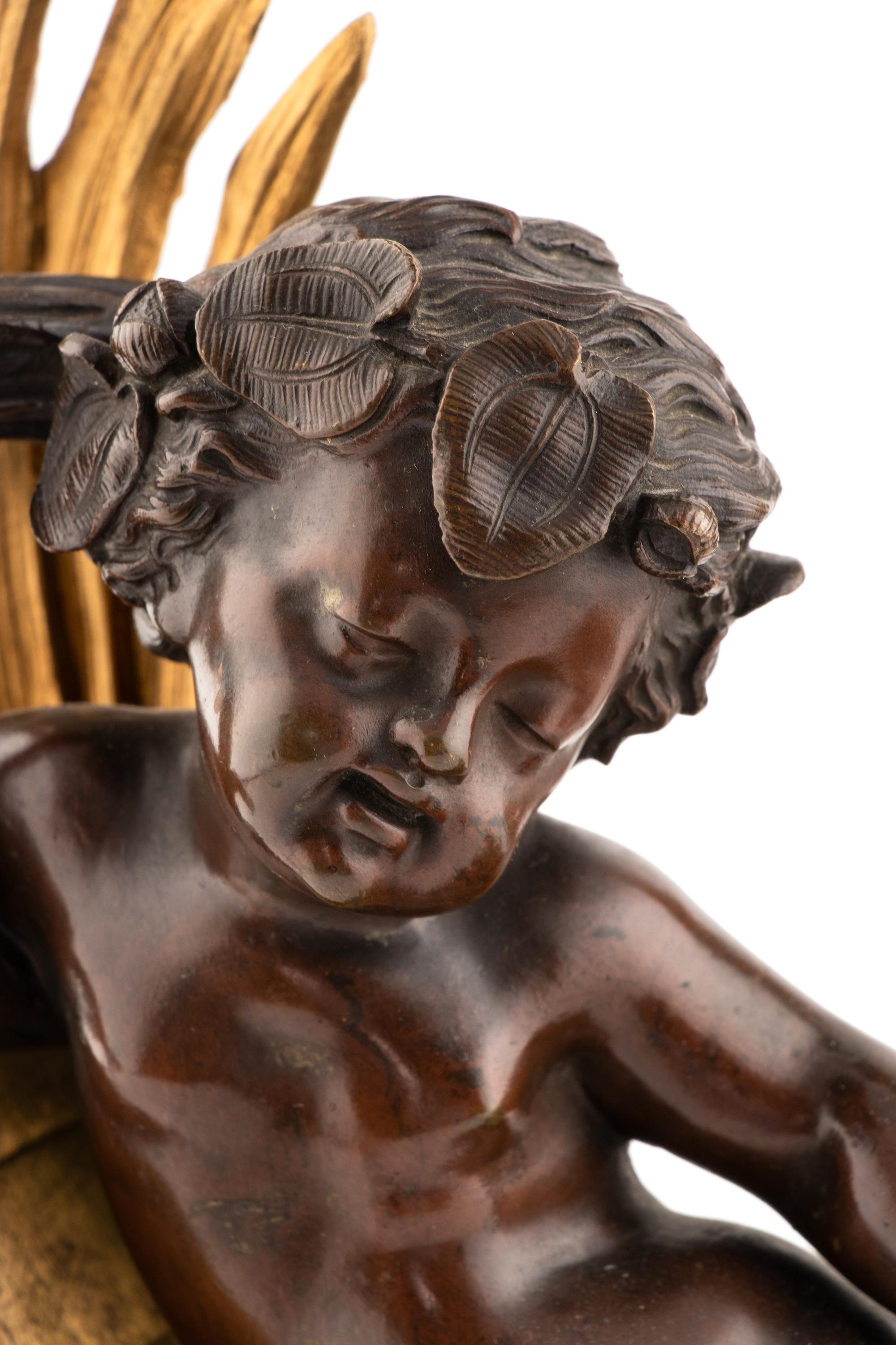 A Pair of Napoleon III Gilt and Patinated Bronze Figural Chenets