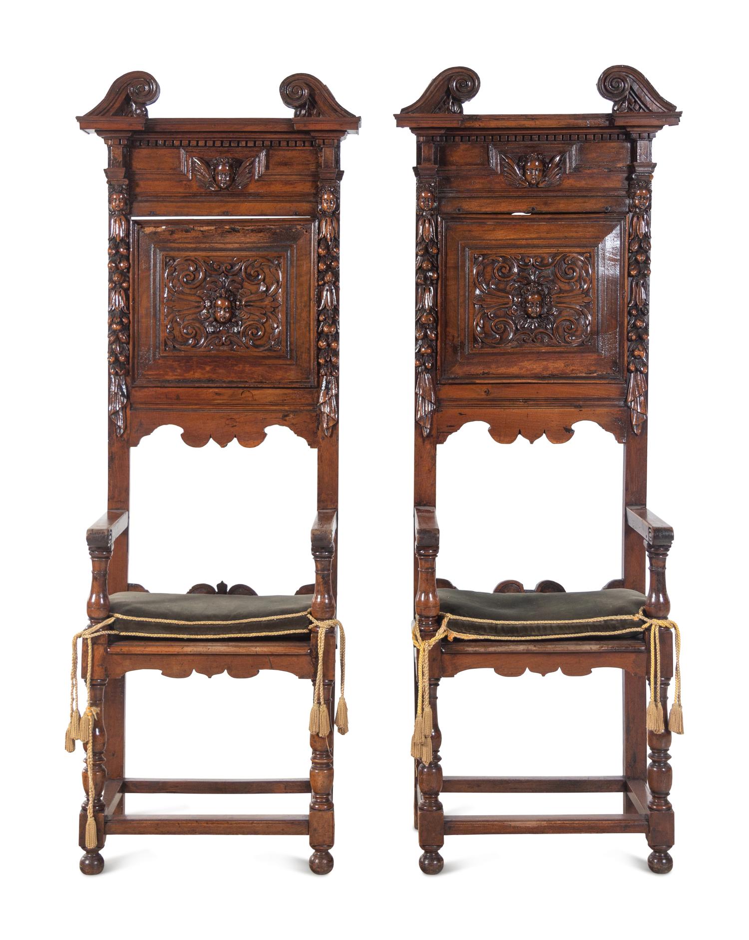 A Pair of Renaissance Revival Carved Walnut Hall Chairs