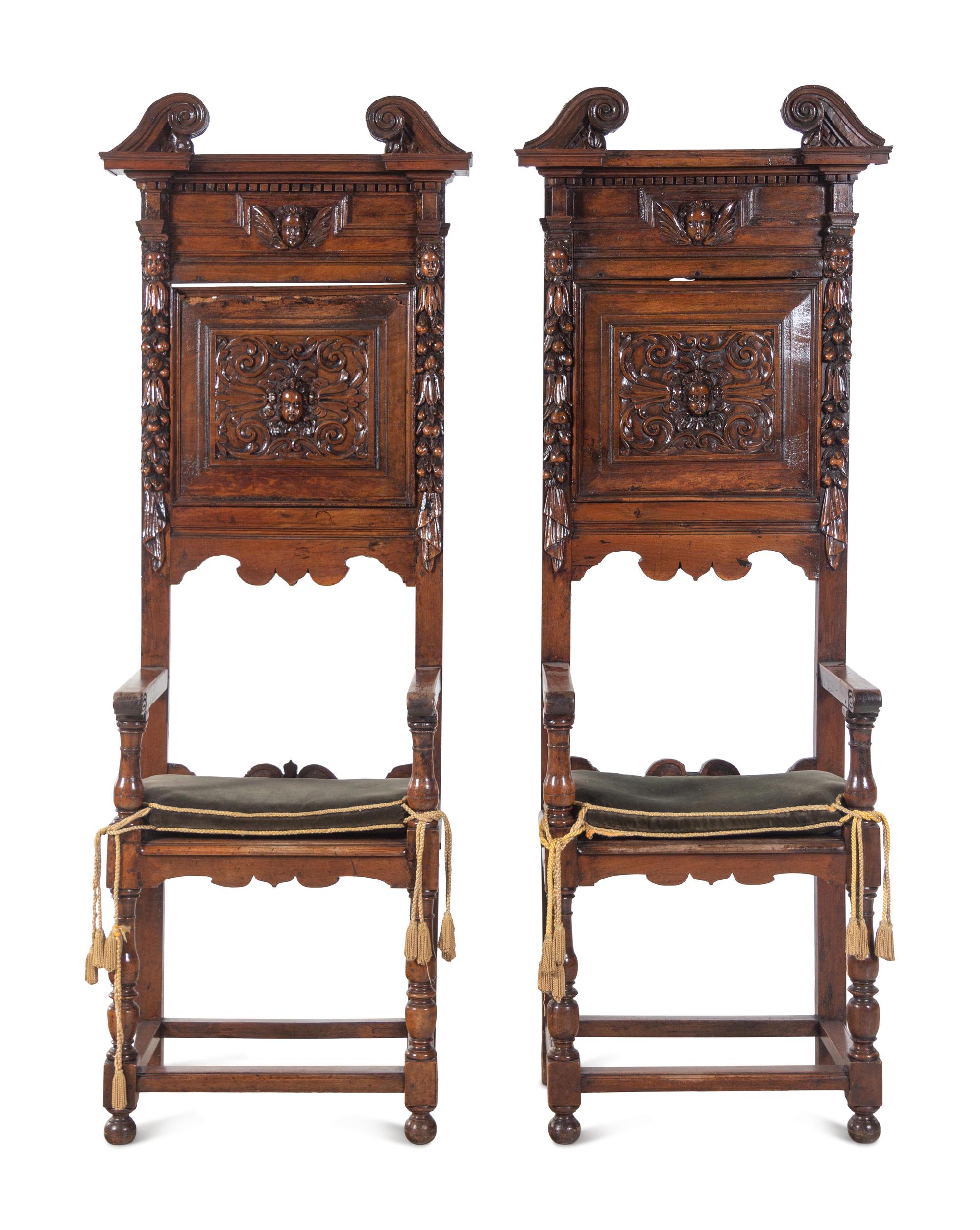 A Pair of Renaissance Revival Carved Walnut Hall Chairs