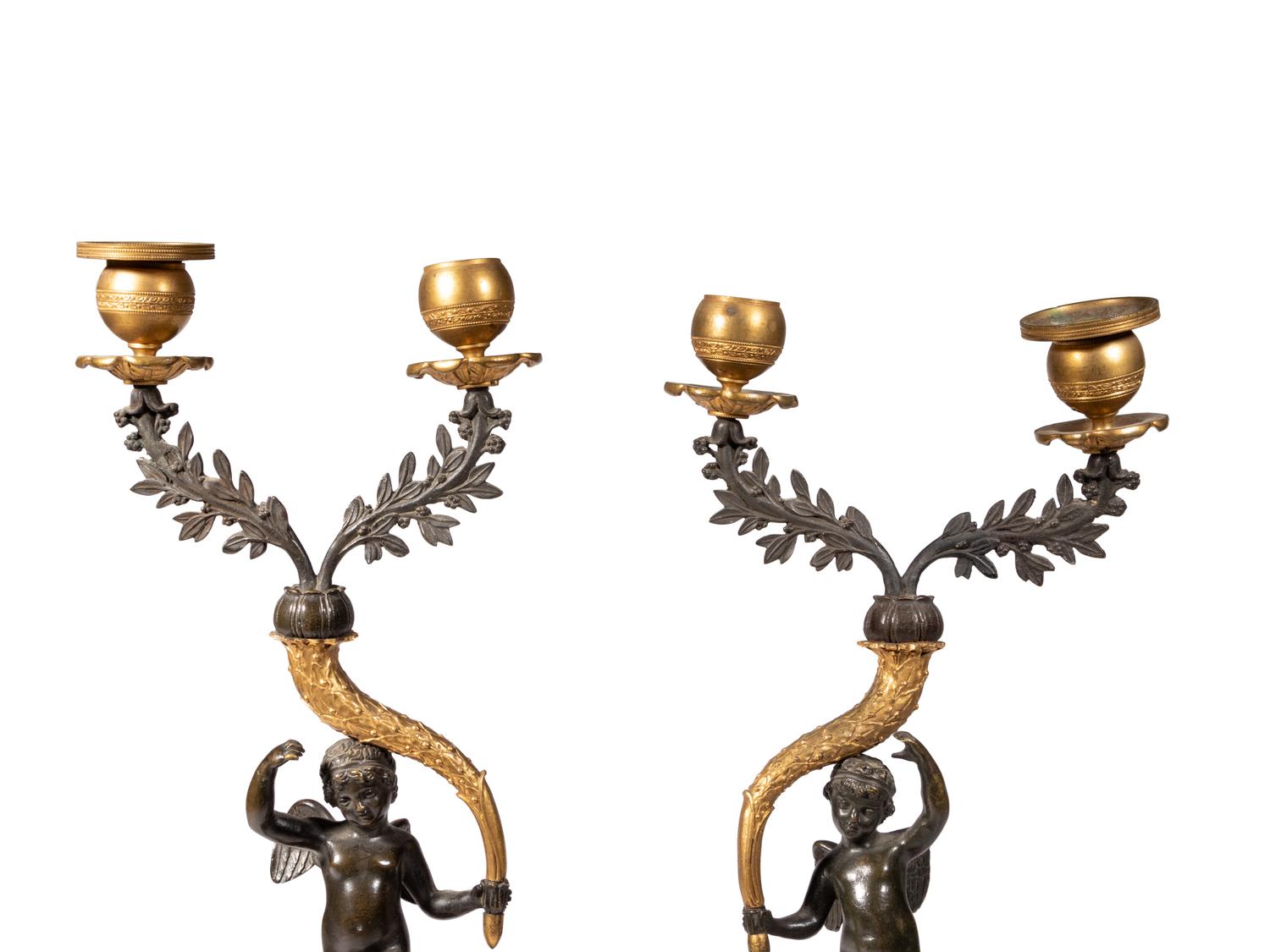 A Pair of Gilt and Patinated Bronze Figural Two-Light Candelabra