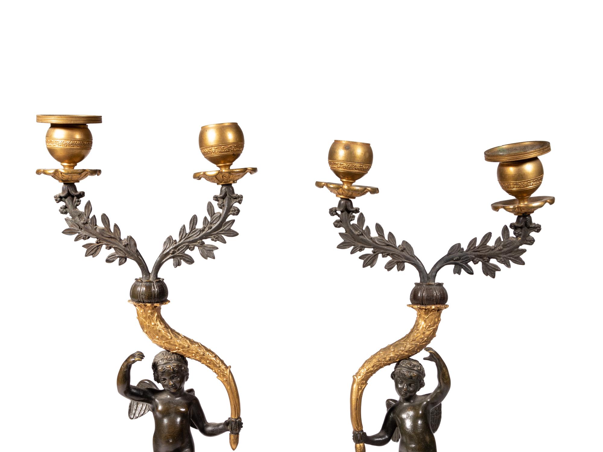 A Pair of Gilt and Patinated Bronze Figural Two-Light Candelabra