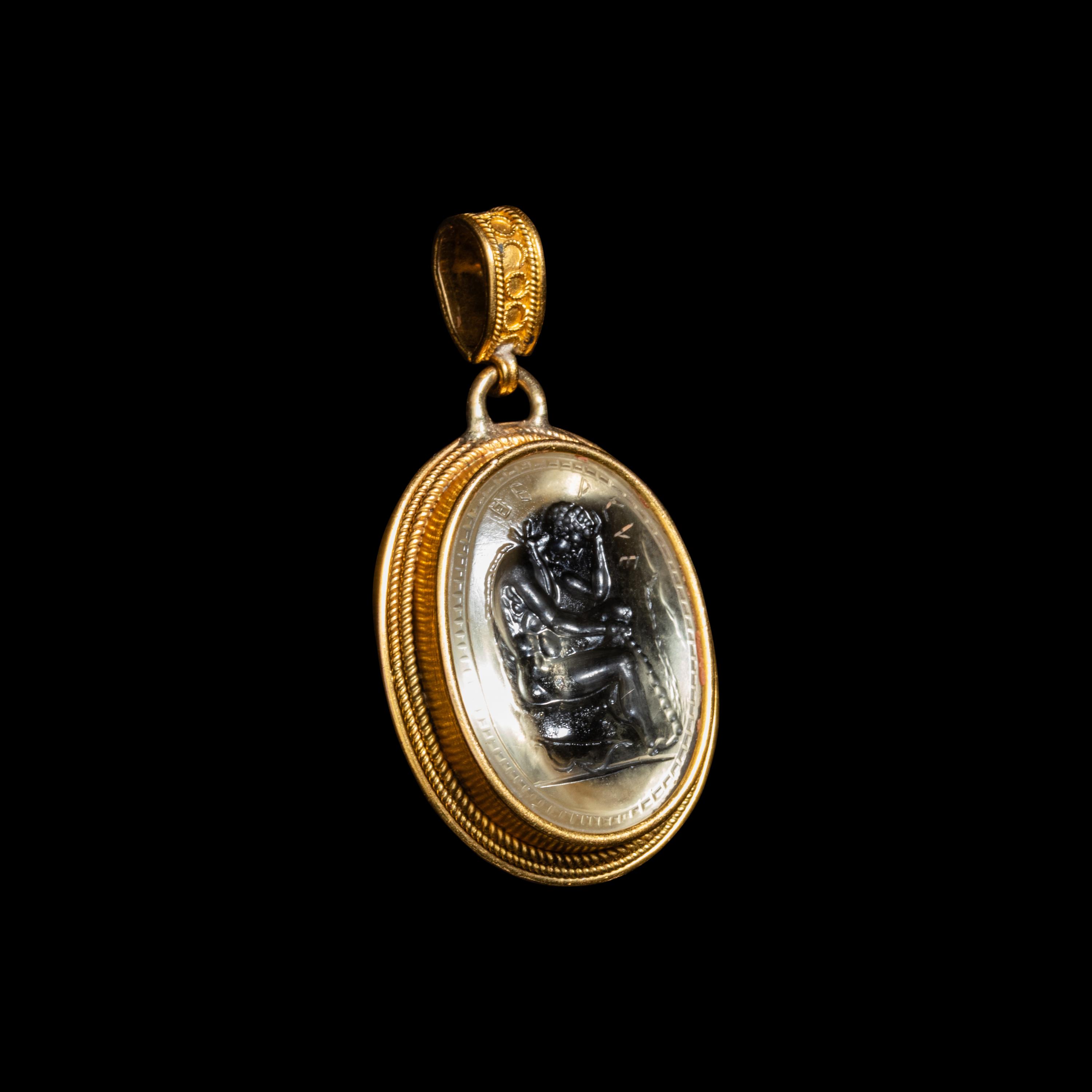 An Etruscan Revival Gold and Rock Crystal Pendant