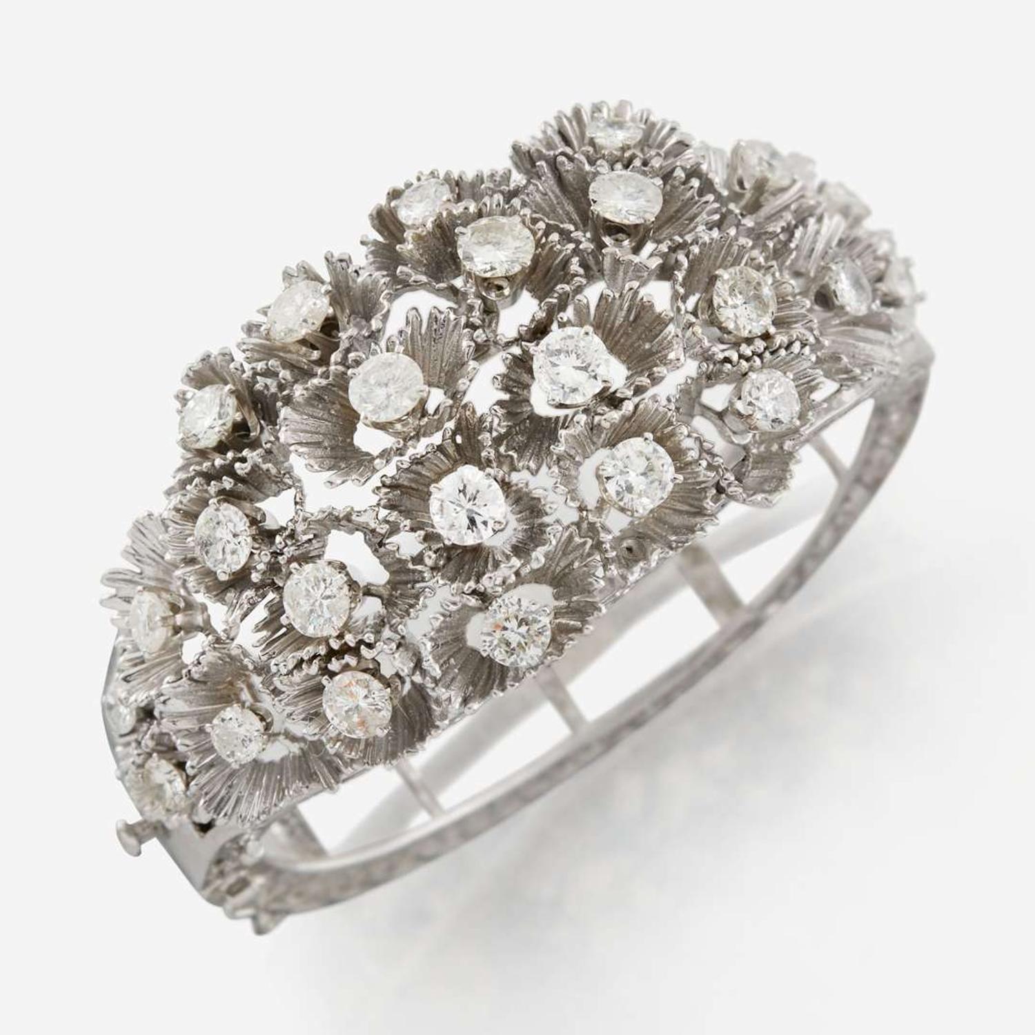 A white gold and diamond bangle