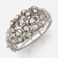 A white gold and diamond bangle