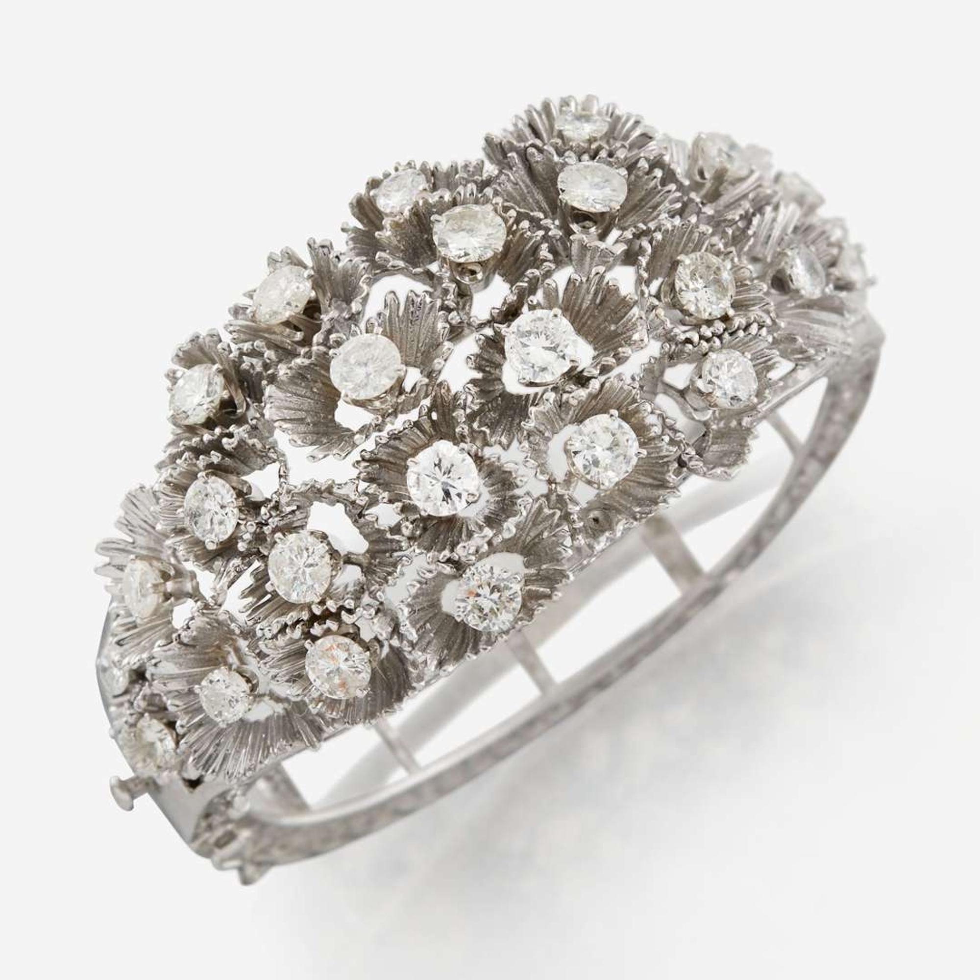 A white gold and diamond bangle