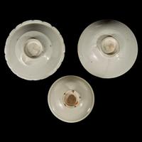 Two Chinese Huozhou White Glazed Bowls and a Stem Cup, Song Dynasty 宋 霍州窯白釉瓷碗二及高足杯一