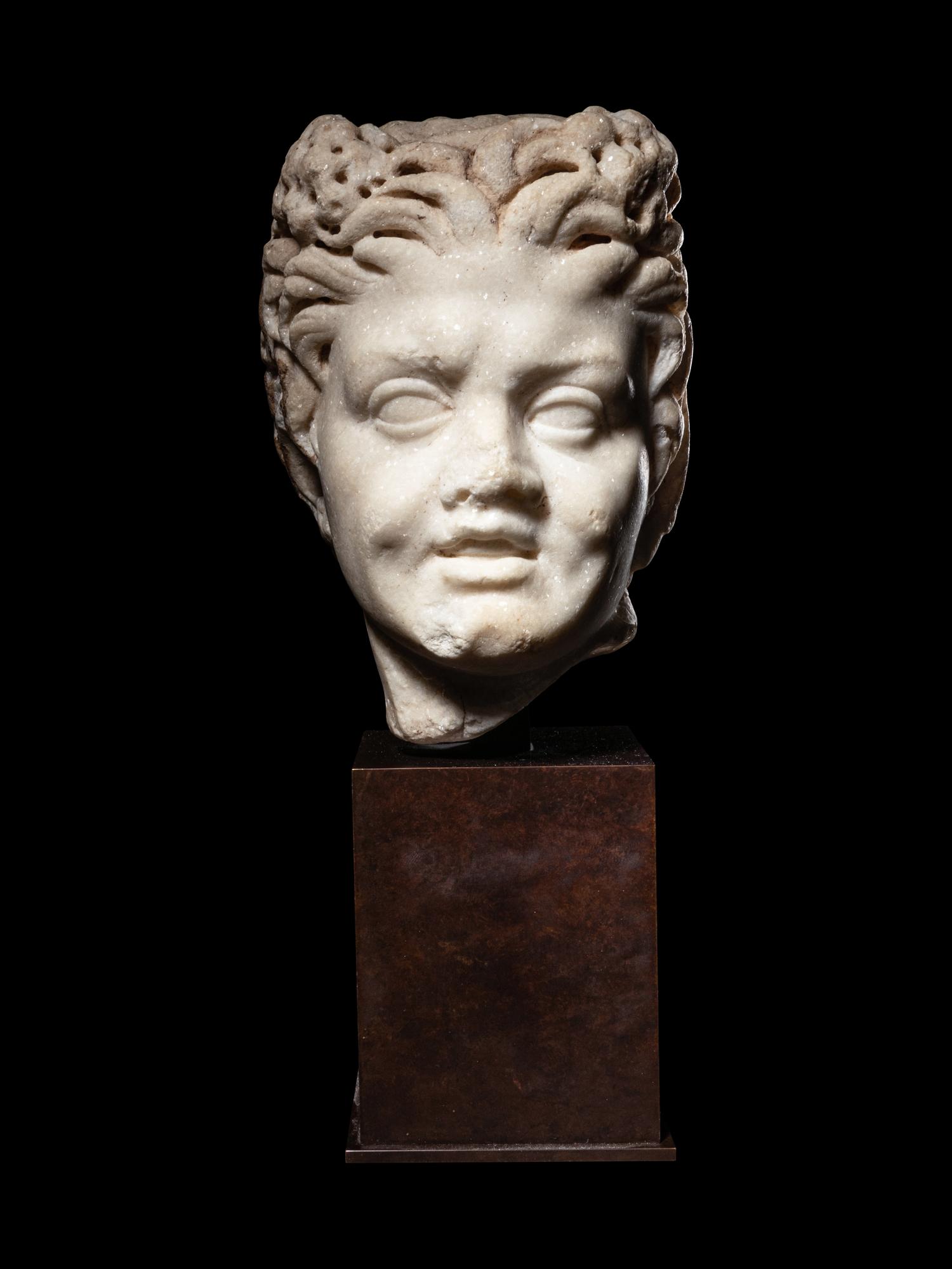 A Roman Marble Satyr Head