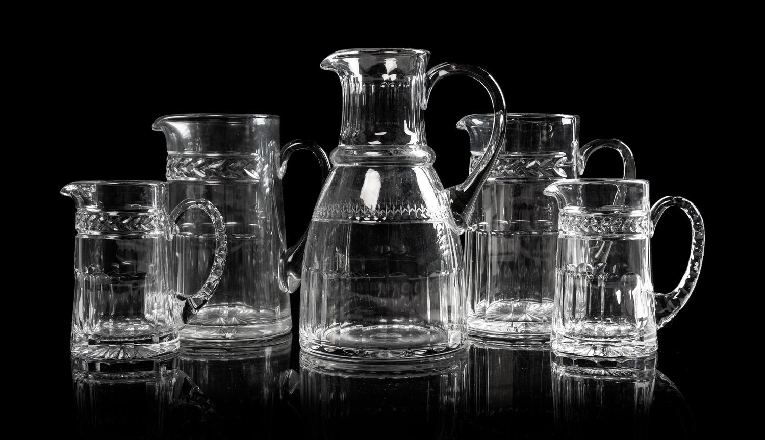 Five William Yeoward Glass Pitchers Height of tallest 9 1/4 inches.