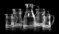 Five William Yeoward Glass Pitchers Height of tallest 9 1/4 inches.