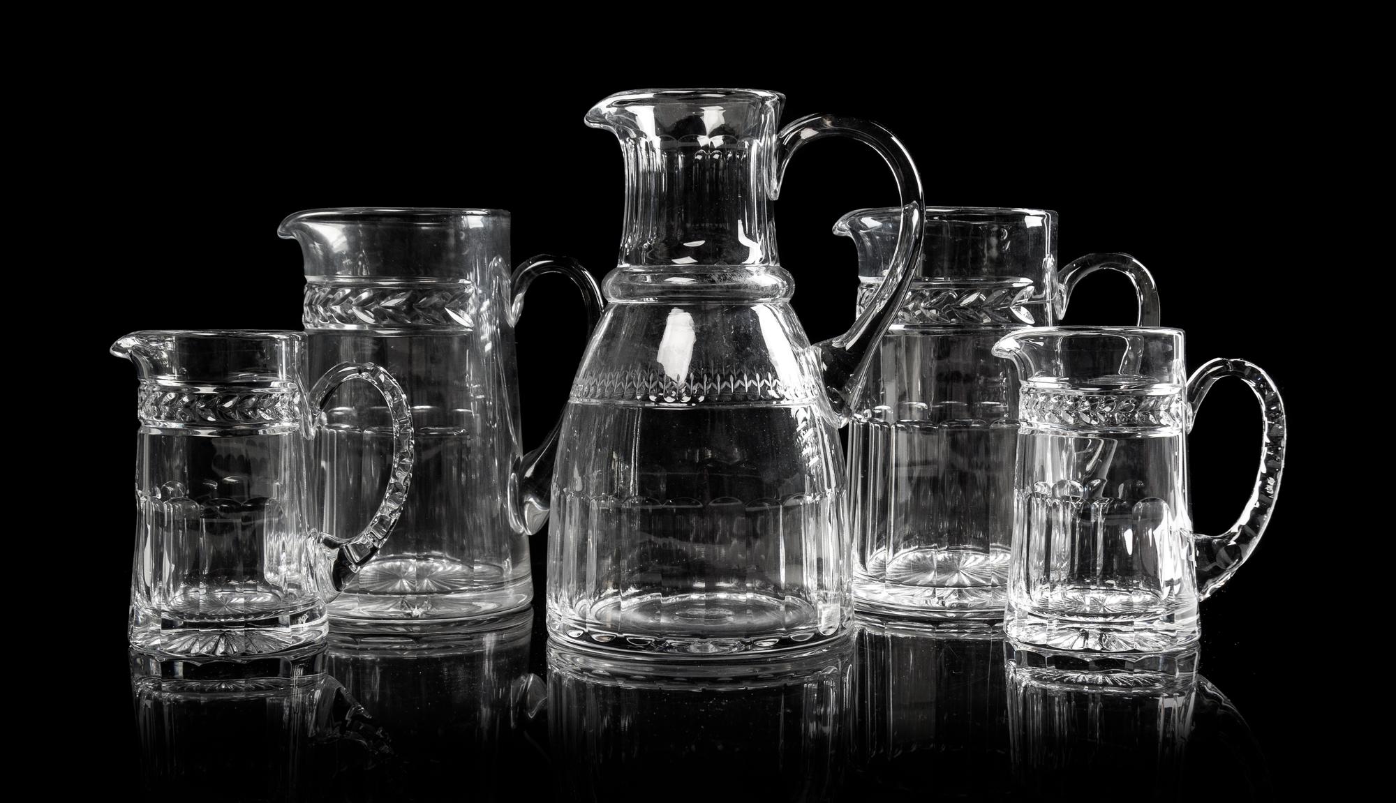 Five William Yeoward Glass Pitchers Height of tallest 9 1/4 inches.