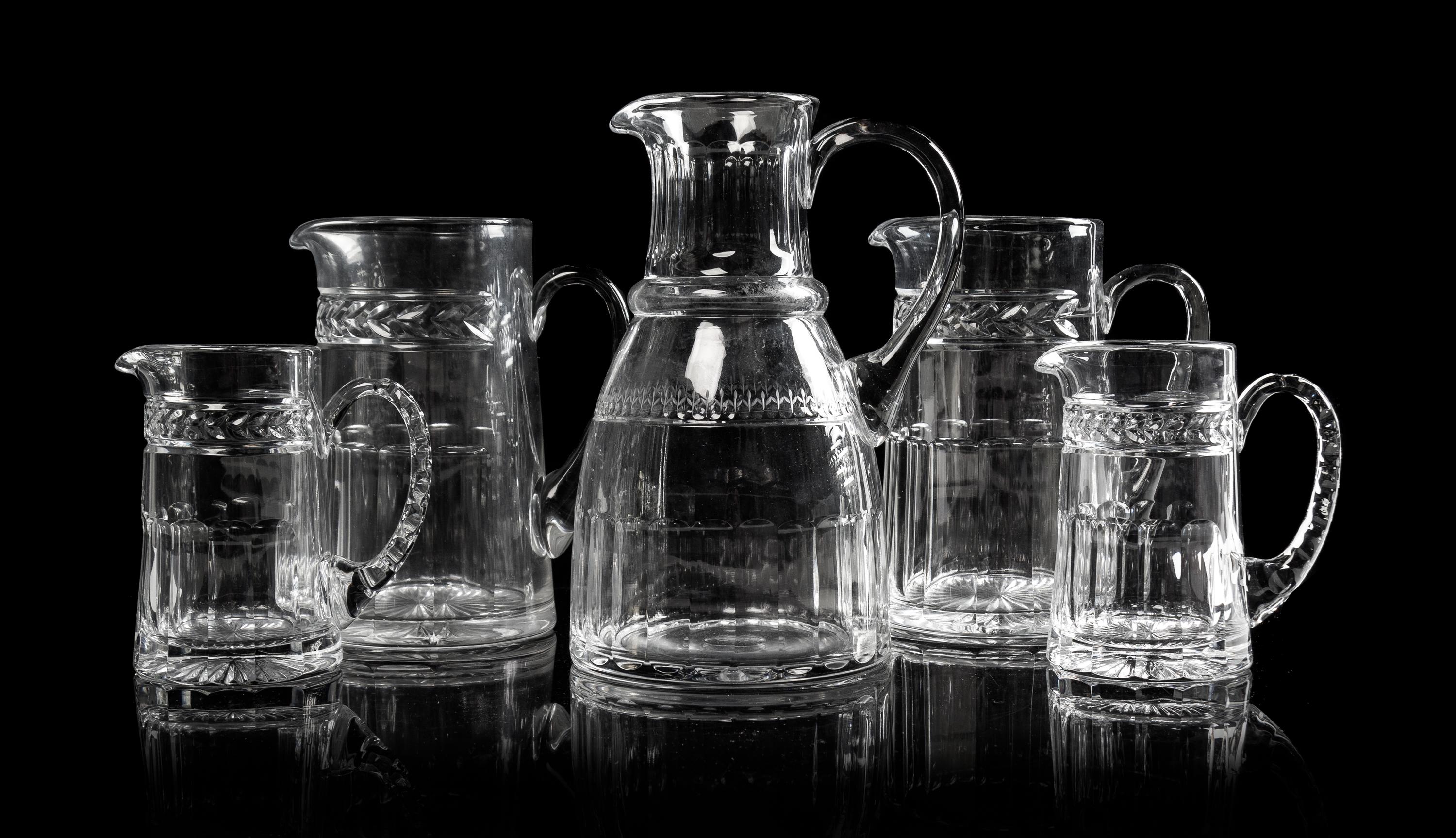 Five William Yeoward Glass Pitchers Height of tallest 9 1/4 inches.