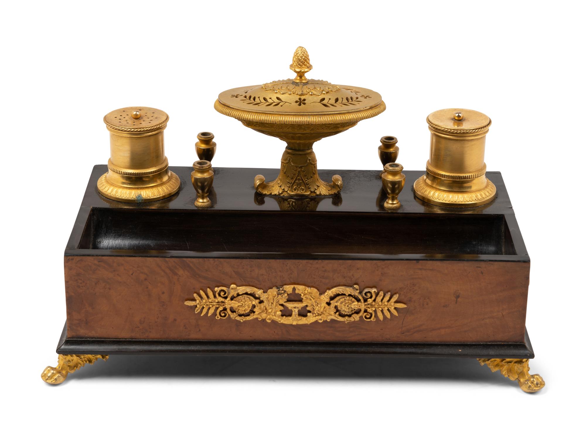 A French Gilt Bronze and Parcel Ebonized Burlwood Encrier