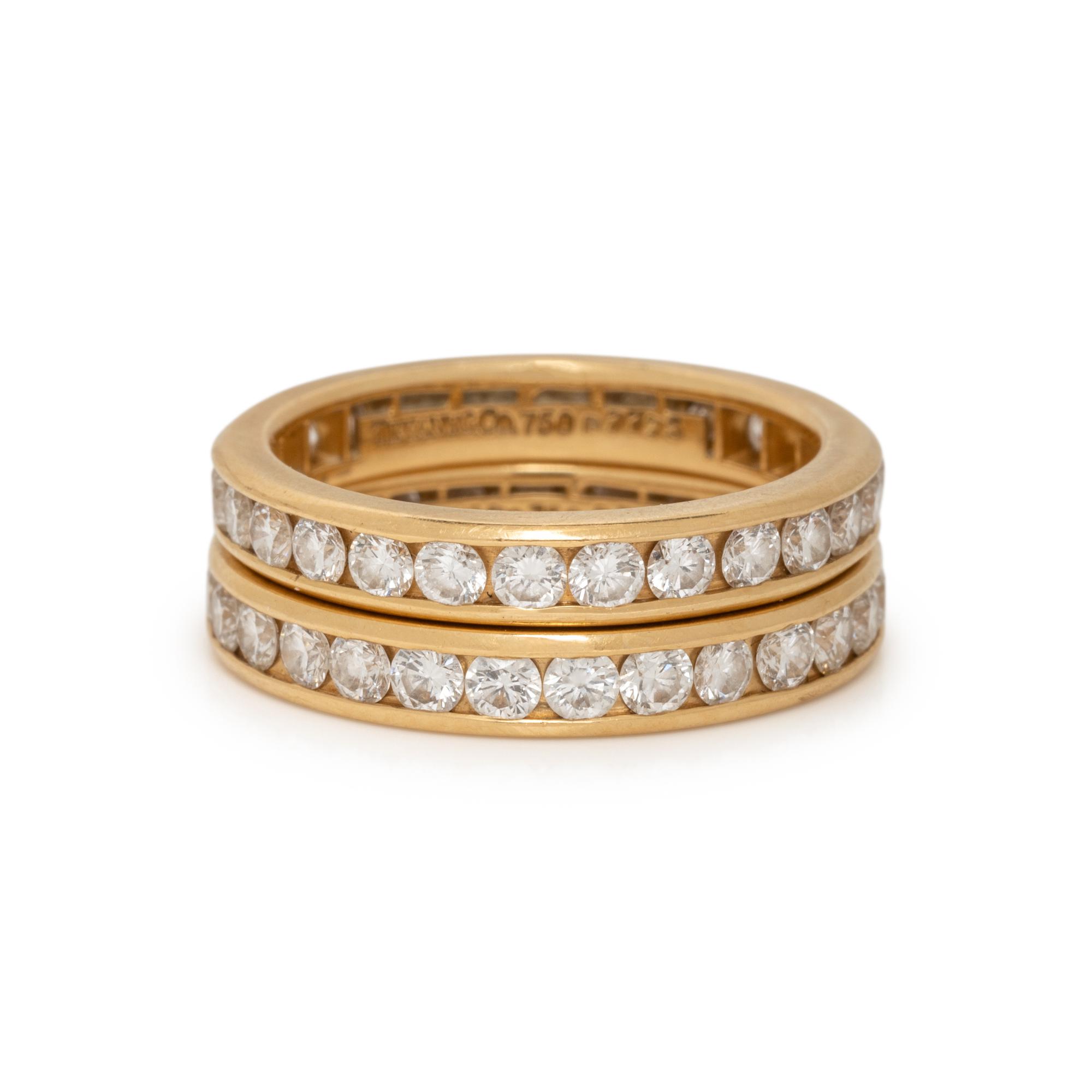 TIFFANY & CO., PAIR OF YELLOW GOLD AND DIAMOND ETERNITY BAND RINGS