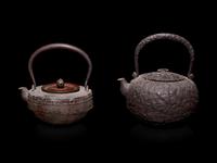 Seven Japanese Cast Iron Teapots, Tetsubin, and Burner