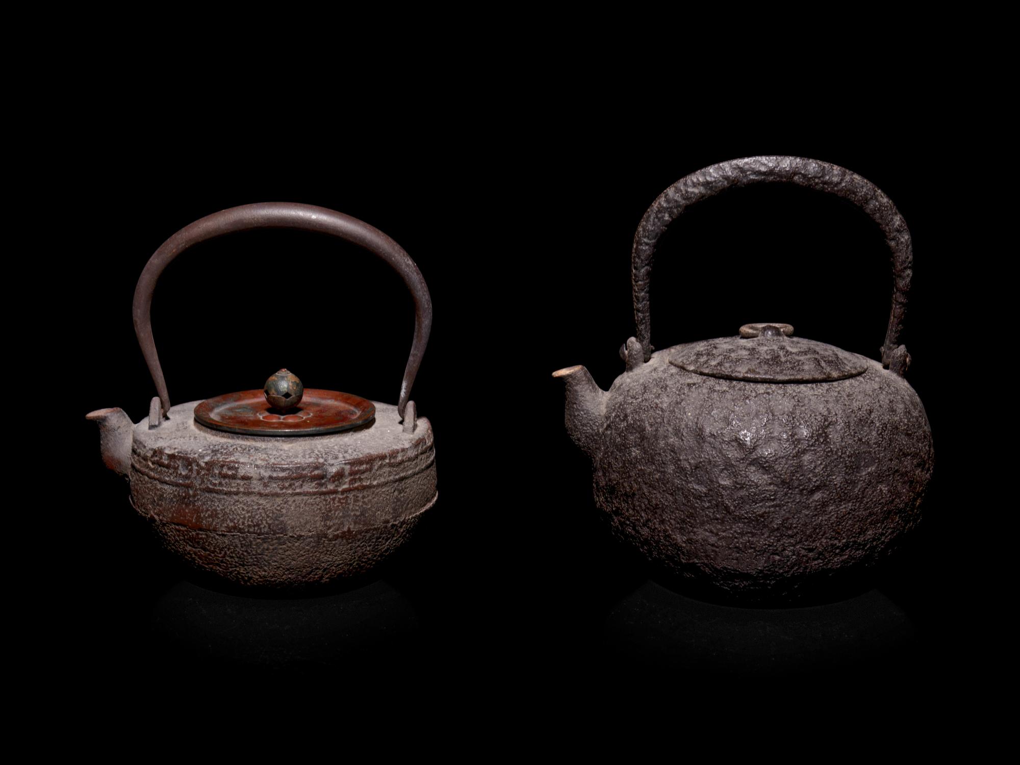 Seven Japanese Cast Iron Teapots, Tetsubin, and Burner