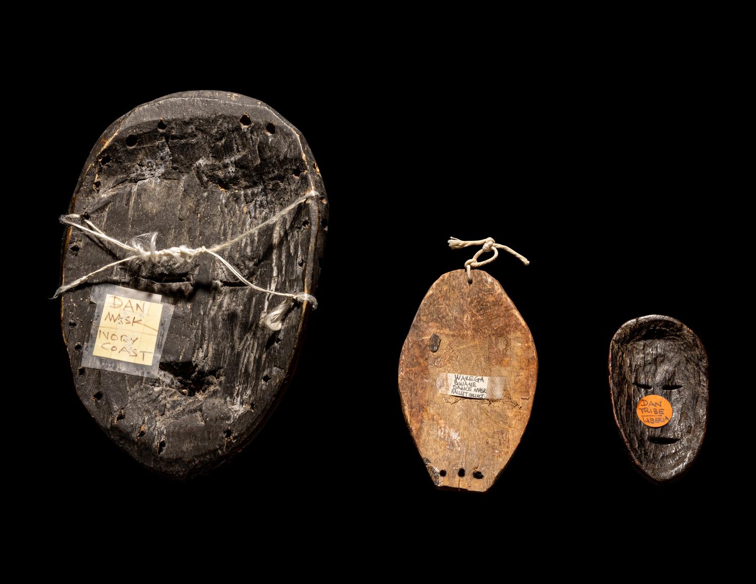 Three Dan Passport Masks, An Ashanti Wood Idol, and Two Wood Figures