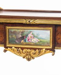 A Louis XV Style Gilt Bronze and Porcelain Mounted Two-Tier Serving Table